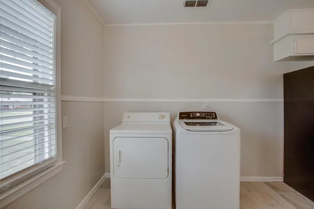 a utility room with dryer and washer