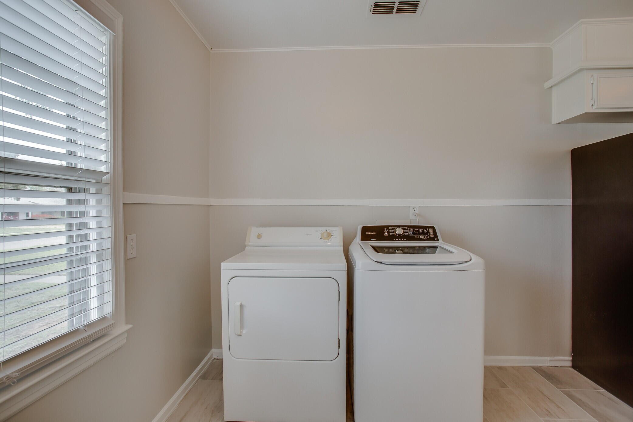 3409 29th Street Lubbock, TX 79410 - Photo 11 of 16 a utility room with dryer and washer