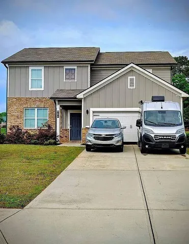 a car parked in front of a house