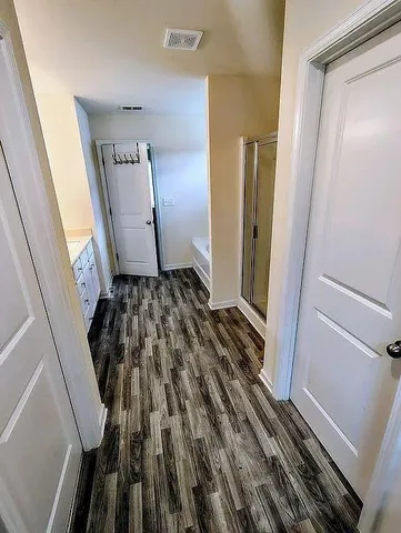 a view of a closet from a hallway
