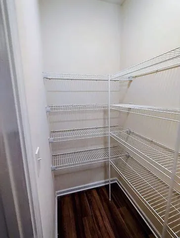 a view of a room with racks on the wall