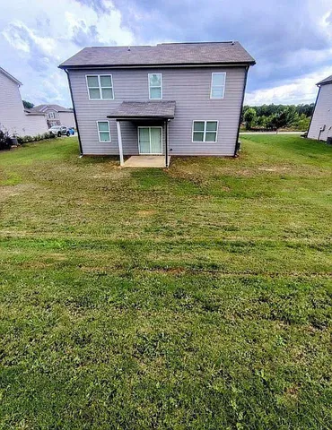 a house view with a garden space