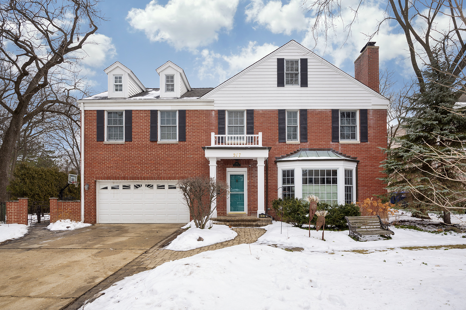 917 Oxford Road Deerfield, IL 60015 - Photo 1 of 19 a front view of a house with a yard covered in snow