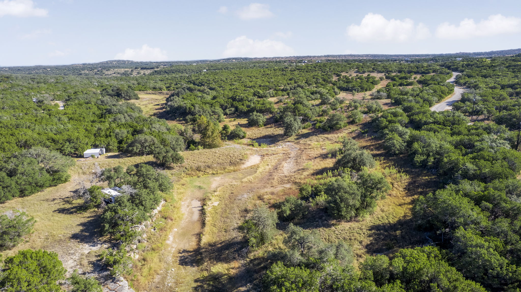 2021 Stagecoach Ranch Road Dripping Springs, TX 78620 - Photo 22 of 35 a view of a city with green space