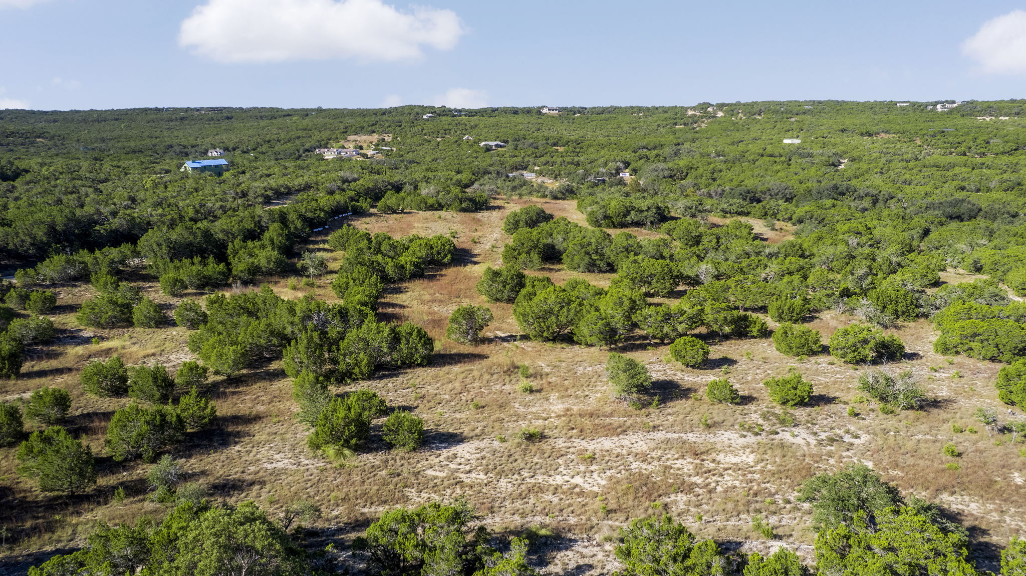 2021 Stagecoach Ranch Road Dripping Springs, TX 78620 - Photo 27 of 35 a view of a field with an outdoor space