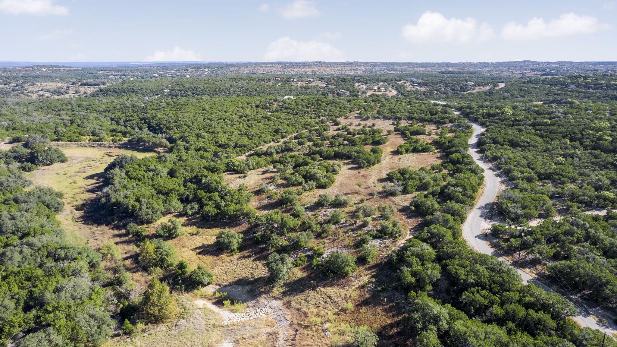 2021 Stagecoach Ranch Road Dripping Springs, TX 78620 - Photo 30 of 35 an aerial view of forest