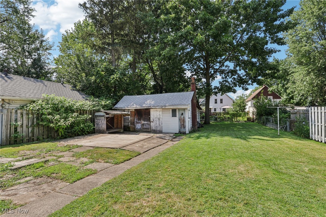 10818 Dixon Road Cleveland, OH 44111 - Photo 37 of 44 Fenced backyard featuring an outdoor structure and a patio