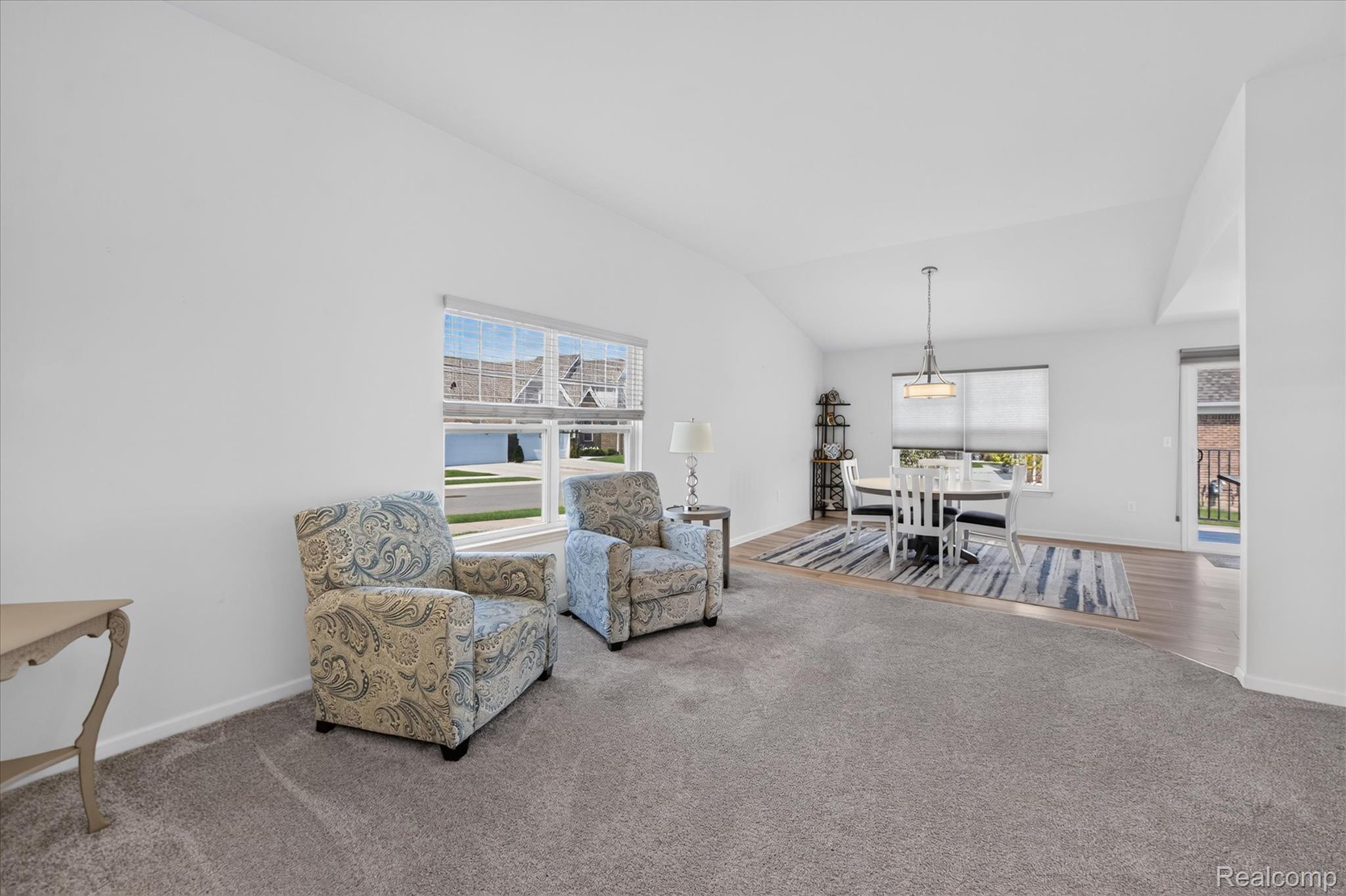 Sunlit living and dining areas with large windows.
