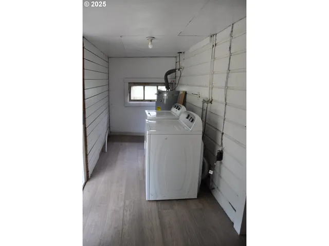 a view of a room with washer and dryer