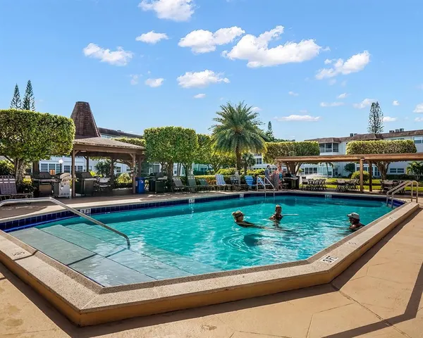 a view of a swimming pool with a patio