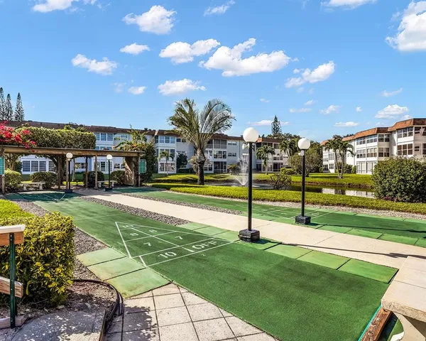 a view of a park with swings and slides