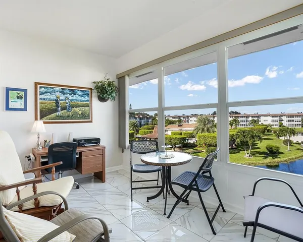a workspace with furniture window and outside view