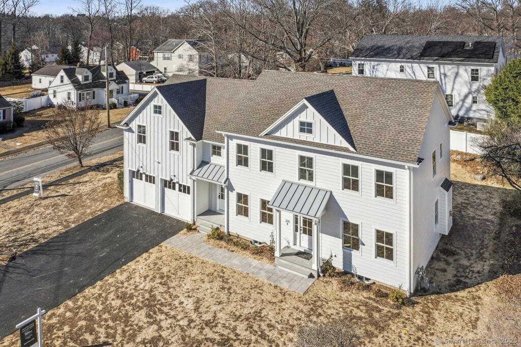 210 Pansy Road Fairfield, CT 06824 - Photo 6 of 14 front view of a house with a yard