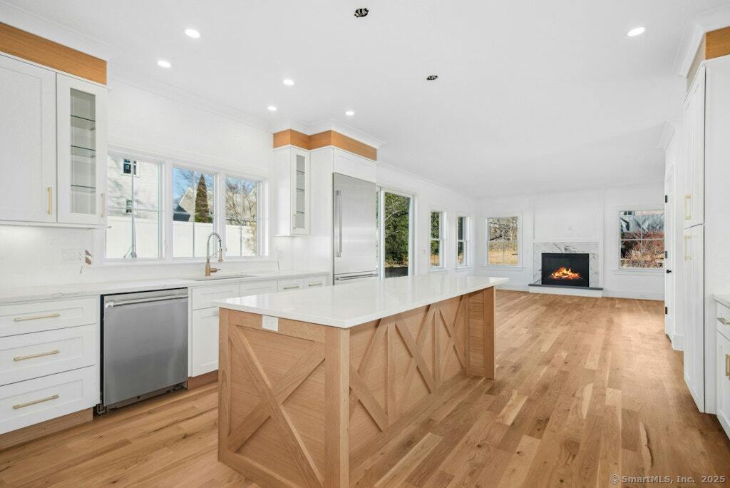 210 Pansy Road Fairfield, CT 06824 - Photo 8 of 14 a large kitchen with granite countertop a large counter top space and stainless steel appliances