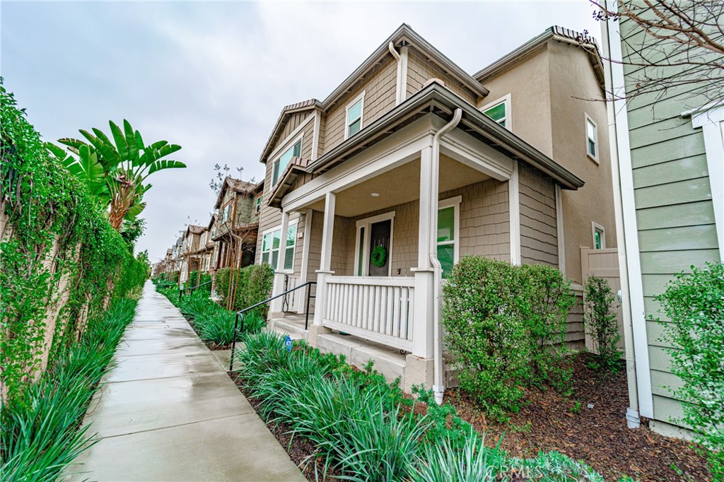 12 Pinot Way Compton, CA 90221 - Photo 1 of 1 a view of a house with a small yard plants and large tree