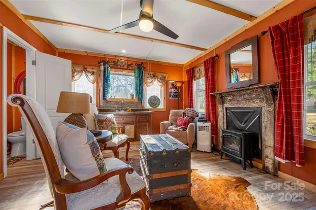 a view of dirt field with trees in the background