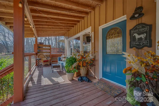 a view of a livingroom with furniture window and wooden floor