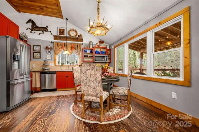 a living room with furniture a rug and a window