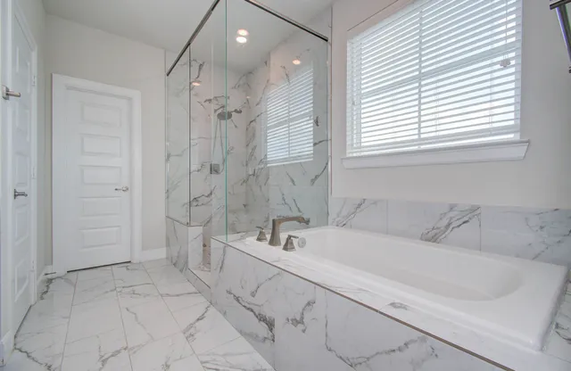 a bathroom with a double vanity sink a mirror and a shower