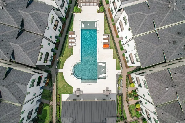 a view of a house with backyard and a patio