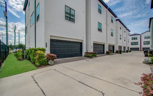 a front view of a house with garage