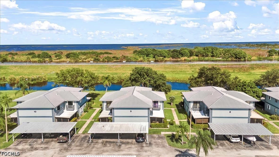 707 Hoover Dike Road, Unit 904 Clewiston, FL 33440 - Photo 2 of 41 a view of a city from a lake