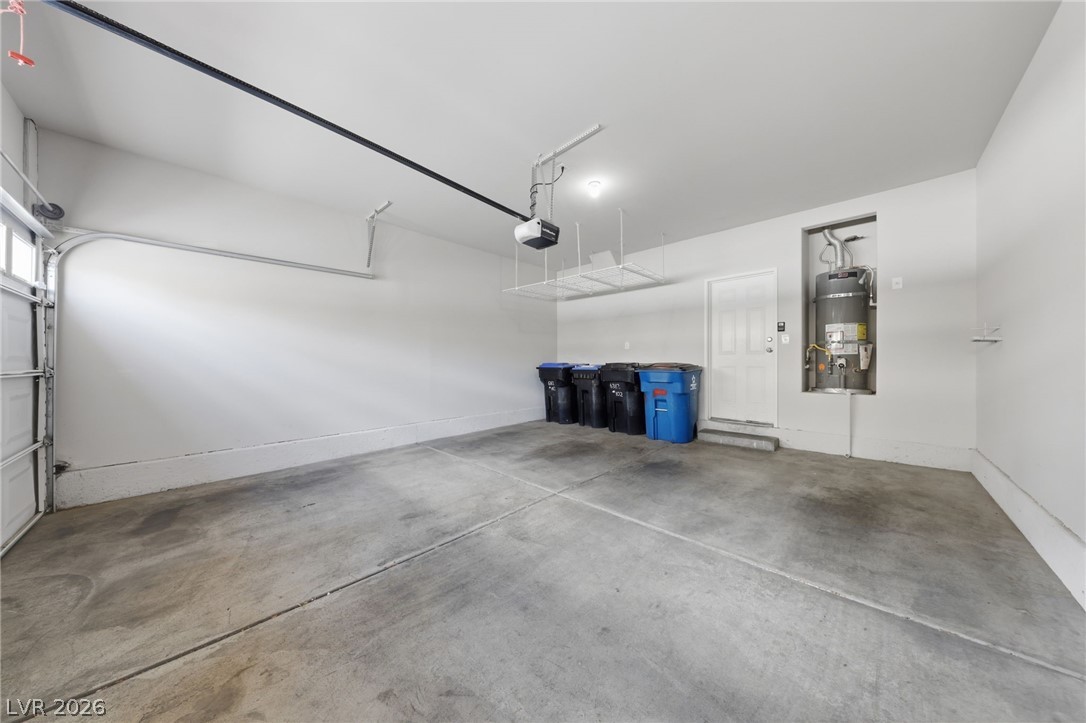 6312 Sandy Ridge Street, Unit 3102 North Las Vegas, NV 89081 - Photo 31 of 31 A spacious garage provides practical storage solutions and secure parking.