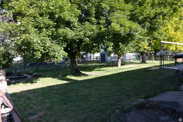 827 South 600 East Logan, UT 84321 - Photo 26 of 30 Expansive lawn area featuring multiple mature trees