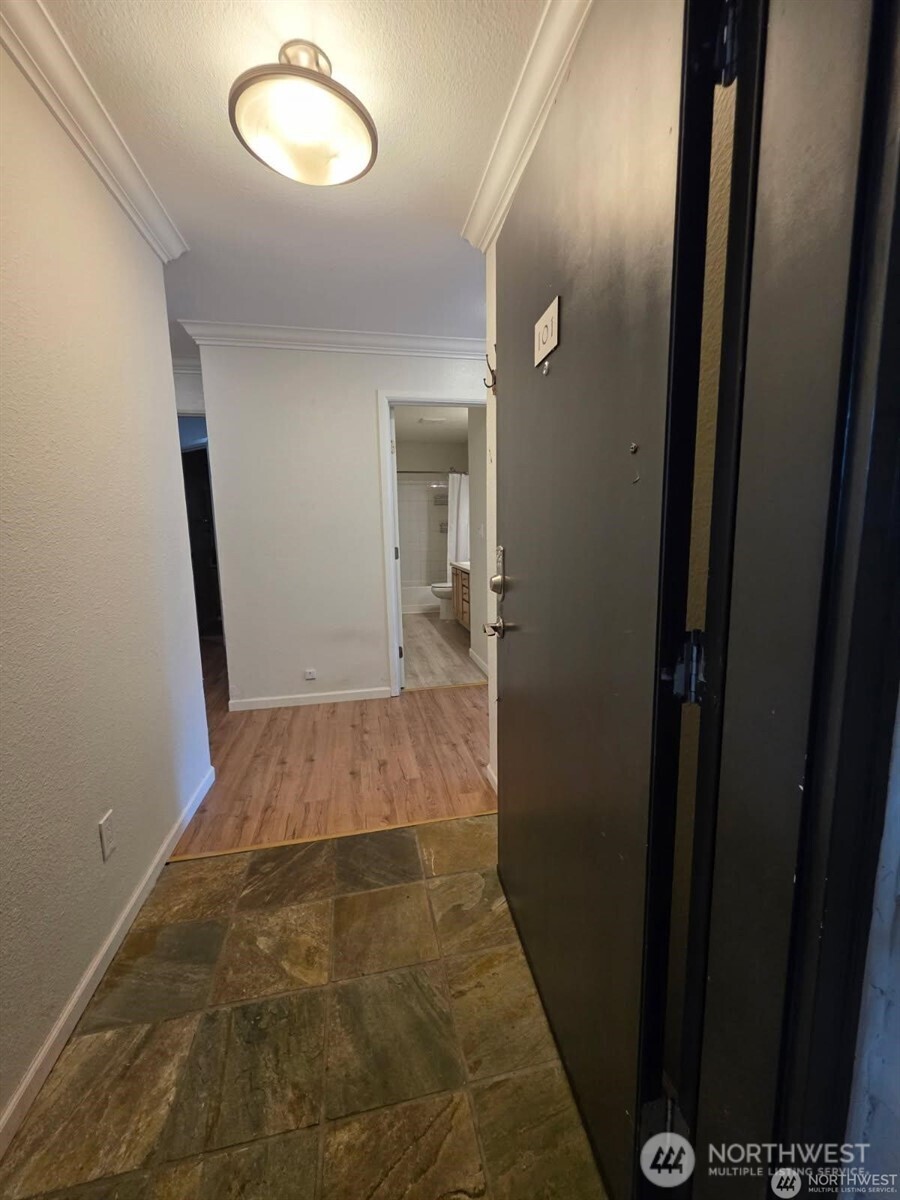 31500 33rd Place Southwest, Unit U101 Federal Way, WA 98023 - Photo 17 of 27 wooden floor in a gallery