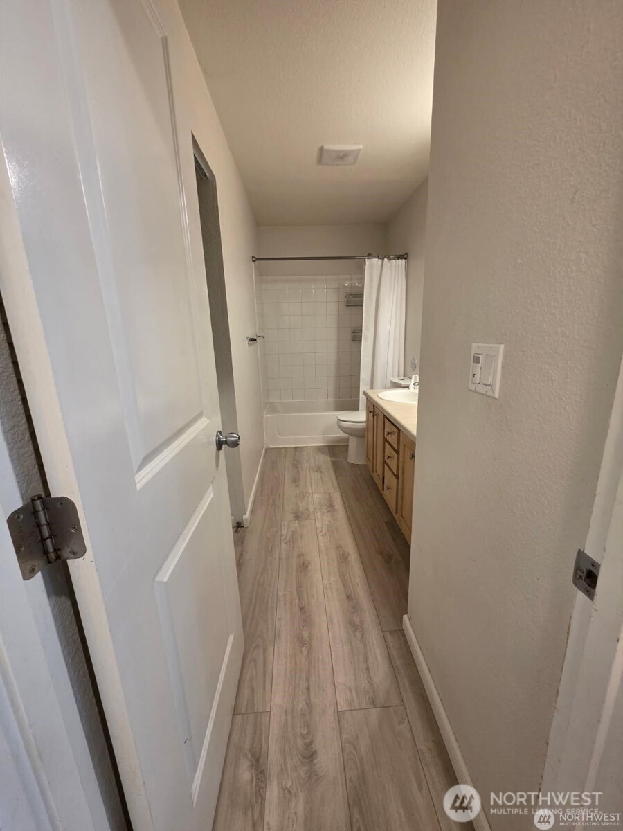 31500 33rd Place Southwest, Unit U101 Federal Way, WA 98023 - Photo 10 of 27 wooden floor in an empty room