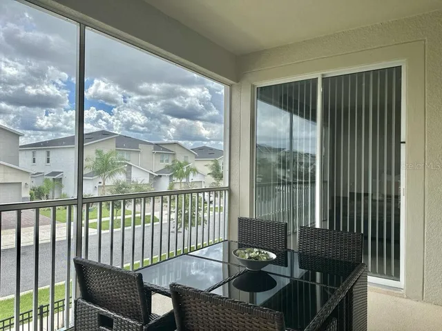 a view of a balcony and chair
