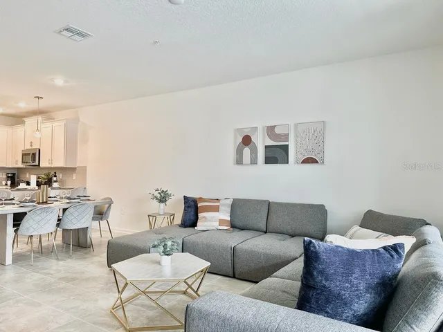 a living room with furniture and a couch