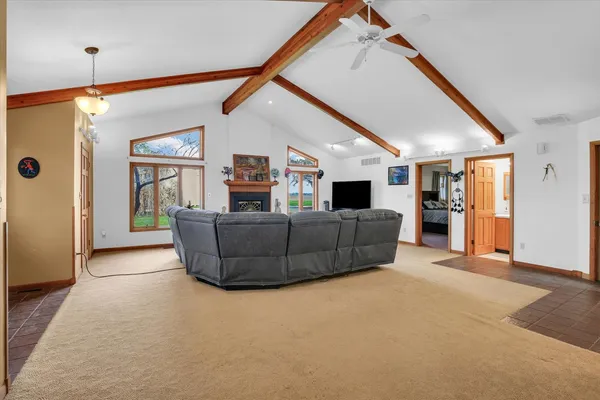 a view of a dining room with furniture wooden floor and a chandelier