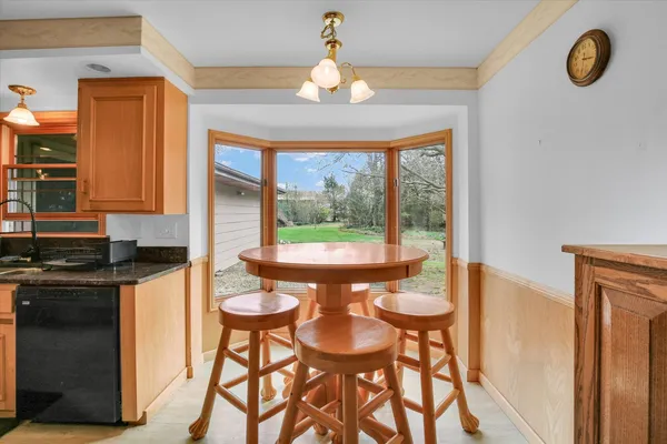 a kitchen with stainless steel appliances granite countertop a refrigerator stove and sink