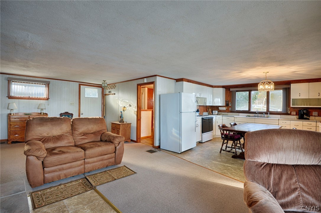 29 Barr Road Oswegatchie, NY 13669 - Photo 9 of 29 Living room and kitchen