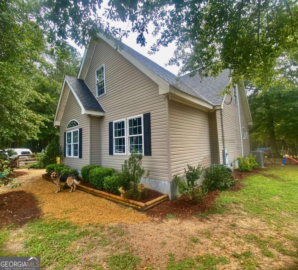 290 Poplar Creek Road Stephens, GA 30667 - Photo 13 of 68 a view of a house with backyard and garden