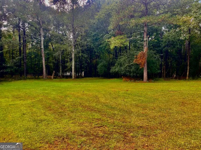 a view of a room with window and stairs