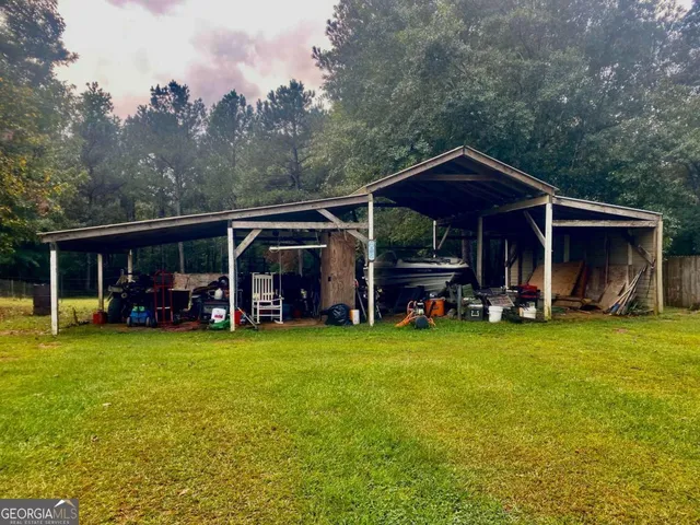 a bathroom with a toilet sink and shower