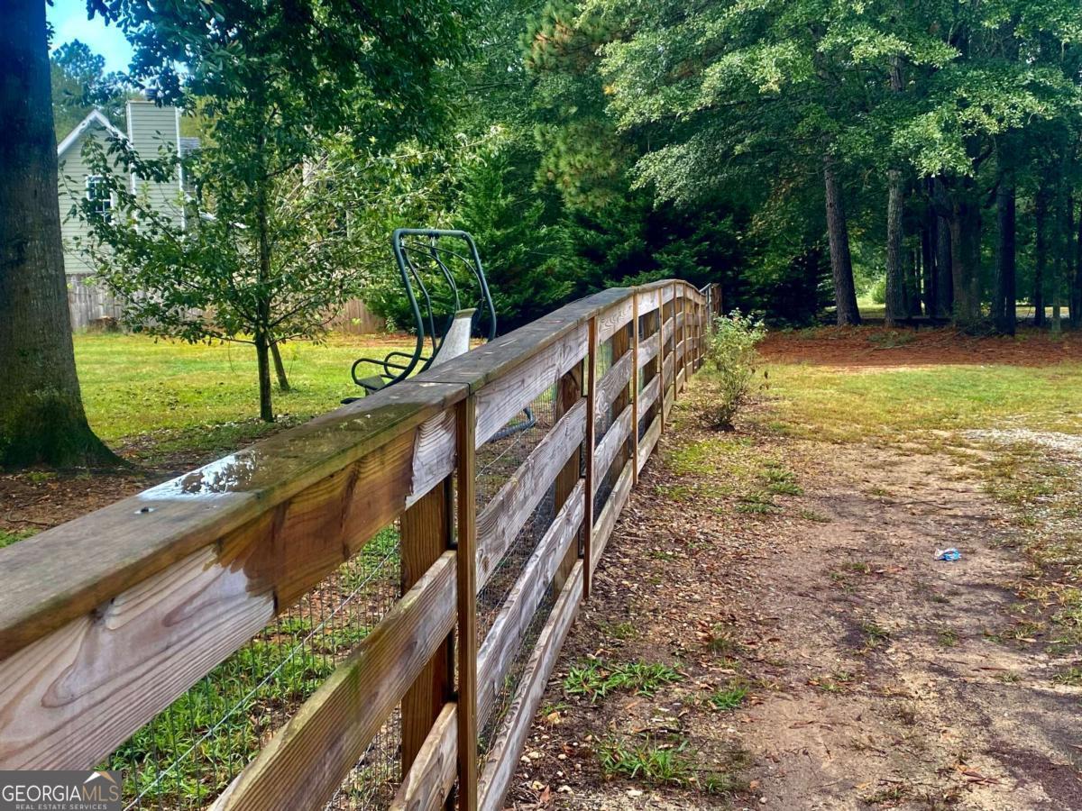 290 Poplar Creek Road Stephens, GA 30667 - Photo 3 of 68 a view of a yard with large trees