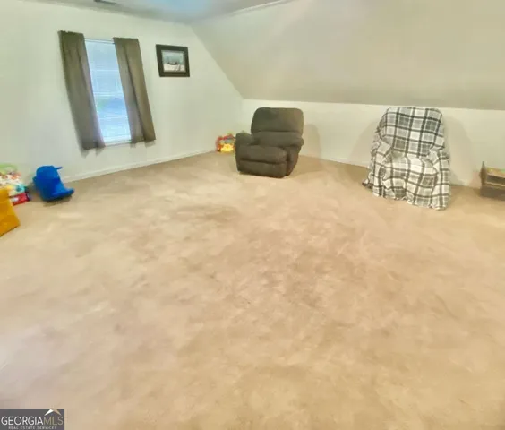 a bedroom with bed and a window