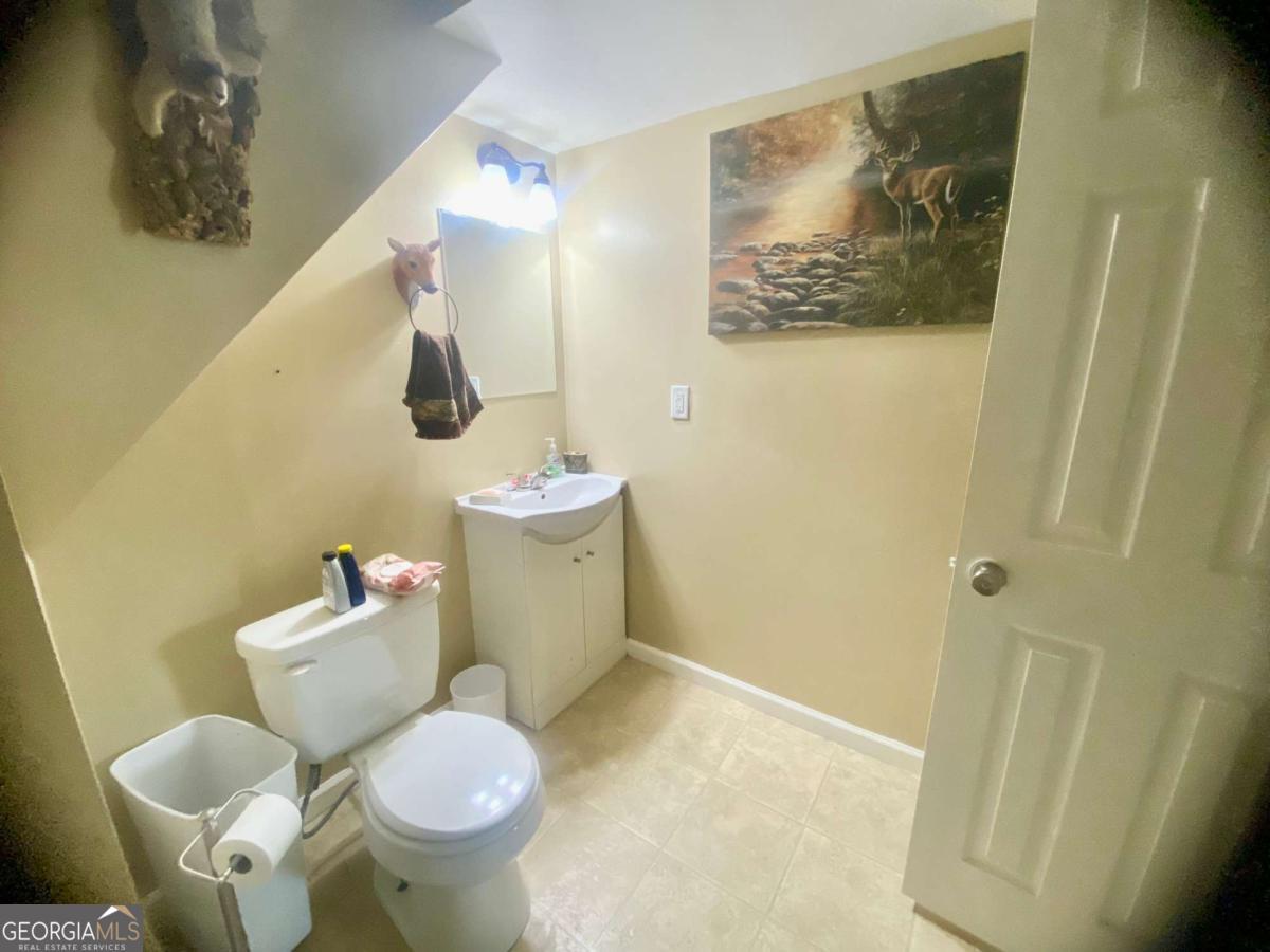 290 Poplar Creek Road Stephens, GA 30667 - Photo 33 of 68 a white toilet sitting next to a small bathroom