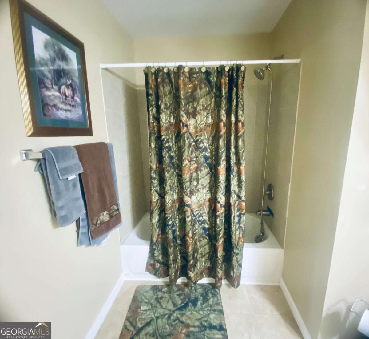 290 Poplar Creek Road Stephens, GA 30667 - Photo 35 of 68 a bathroom with a shower curtain and a toilet