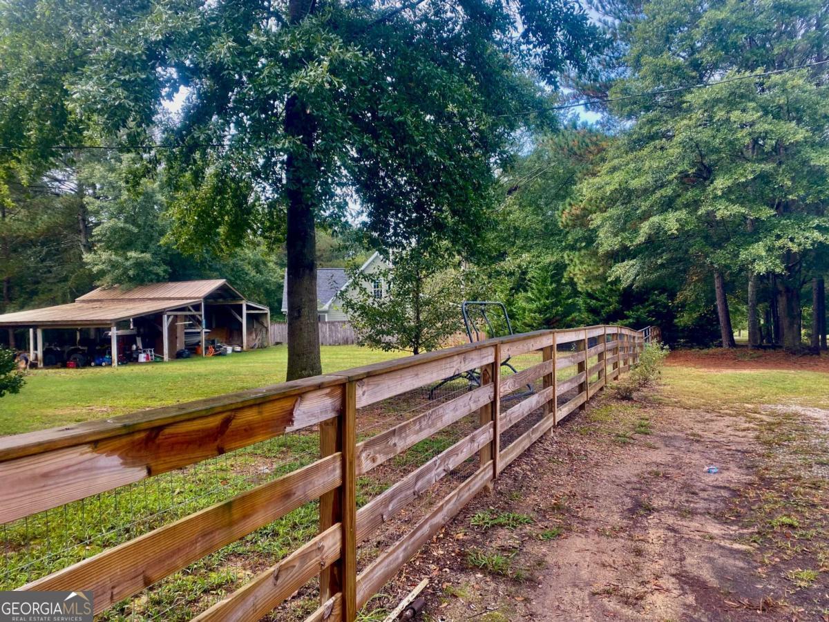 290 Poplar Creek Road Stephens, GA 30667 - Photo 4 of 68 a view of a house with a yard