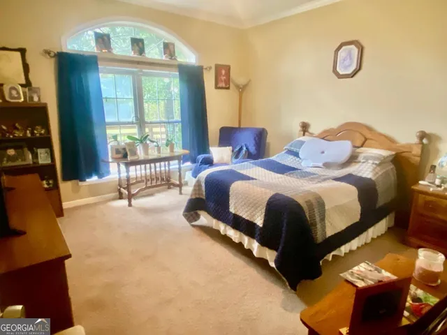 a kitchen with appliances a sink and cabinets