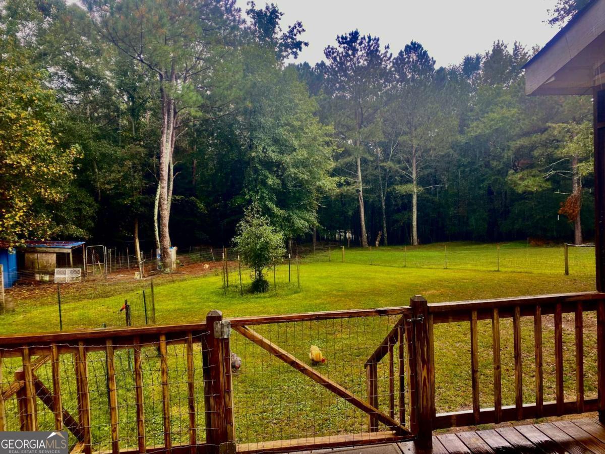 290 Poplar Creek Road Stephens, GA 30667 - Photo 66 of 68 a view of swimming pool with a backyard and trees