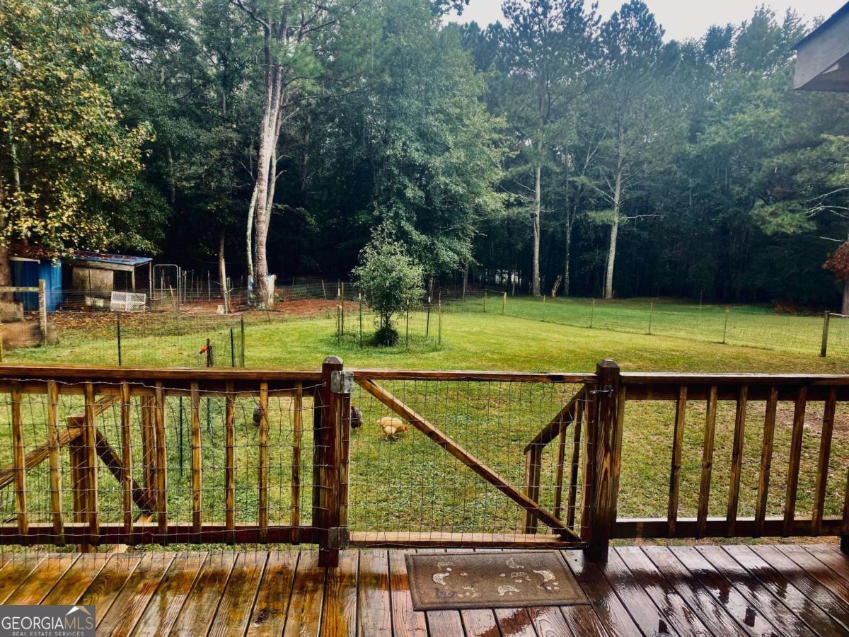 290 Poplar Creek Road Stephens, GA 30667 - Photo 67 of 68 a view of a swimming pool with a patio and a yard