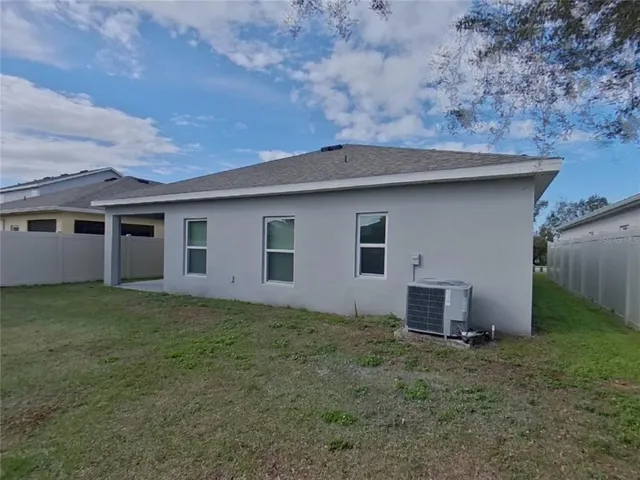 a backyard of a house with lots of green space