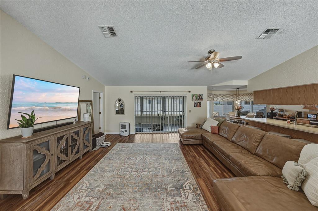 7435 Kilbride Court Weeki Wachee, FL 34613 - Photo 8 of 67 a living room with furniture and a flat screen tv