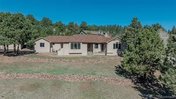 a house with trees in the background
