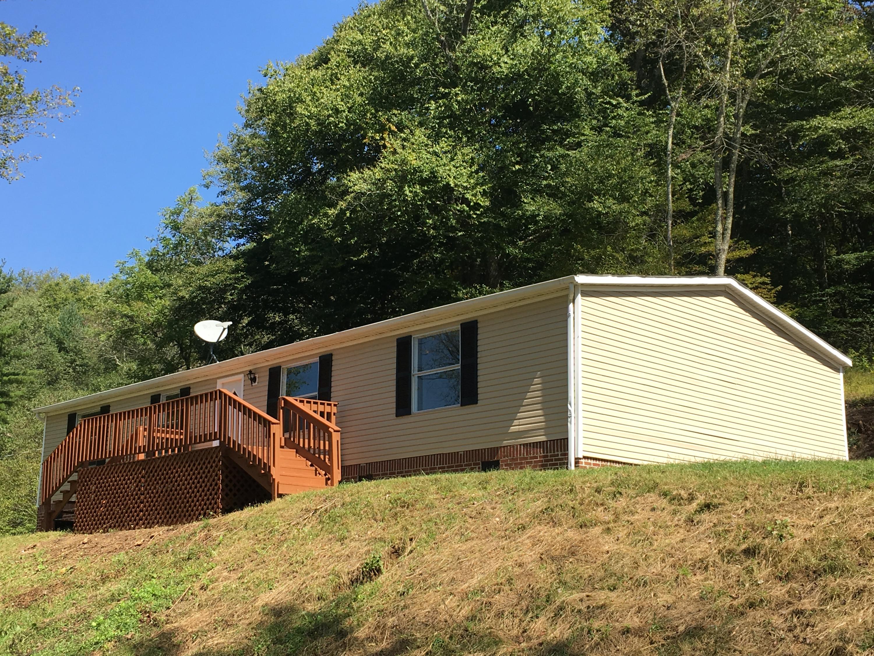 2205 Conner Grove Road Southwest Willis, VA 24380 - Photo 1 of 18 a view of a house with a backyard